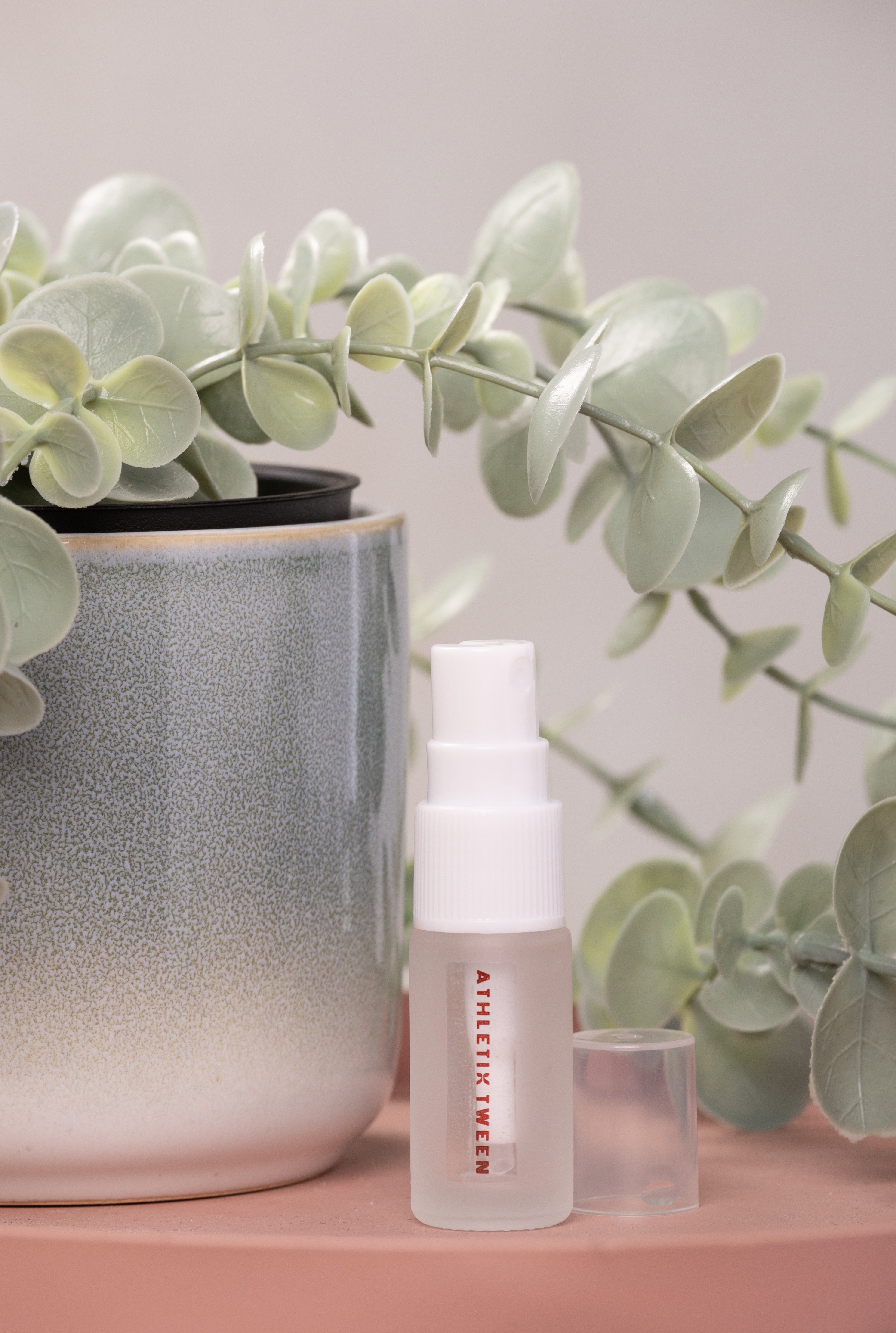 Skincare bottle with a plant in the background